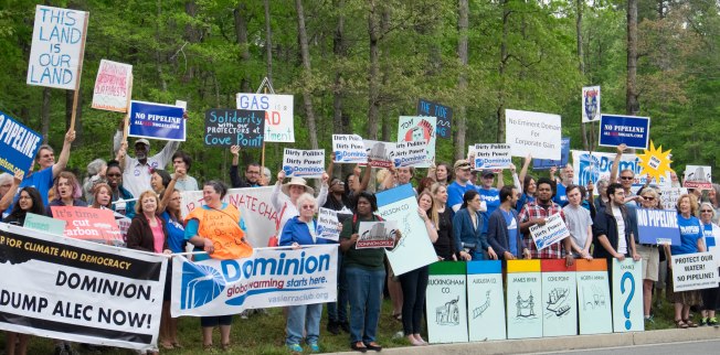 Protesters lined the road leading to the Dominion shareholder meeting in Richmond. Photo credit Corrina Beall.