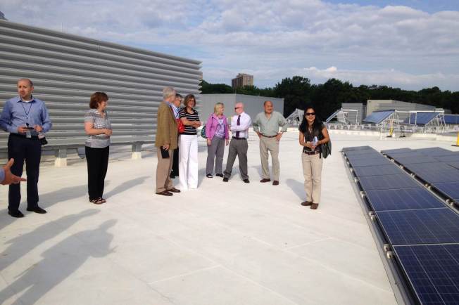 Visitors tour the solar installation on the roof of Wakefield HS in Arlington. Photo credit Phil Duncan