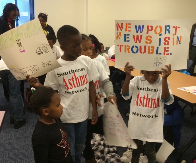 Children from the Southeast Care Coalition make their point about the link between air quality and asthma. 